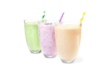 Fruit milk shakes on white background