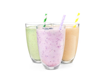 Fruit milk shakes on white background
