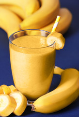 Banana milkshake on color background