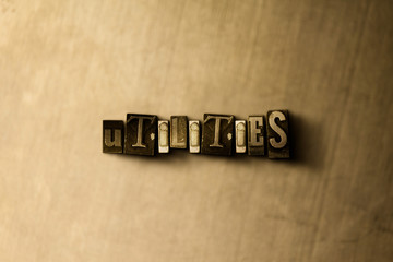 UTILITIES - close-up of grungy vintage typeset word on metal backdrop. Royalty free stock - 3D rendered stock image.  Can be used for online banner ads and direct mail.