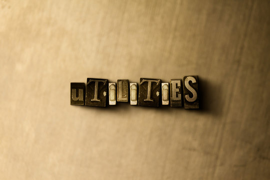UTILITIES - close-up of grungy vintage typeset word on metal backdrop. Royalty free stock - 3D rendered stock image.  Can be used for online banner ads and direct mail.