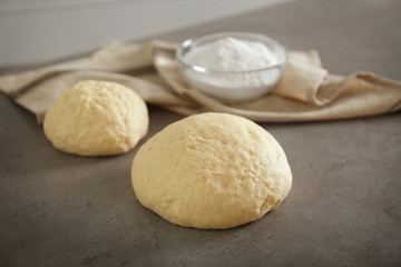 Raw dough on kitchen table