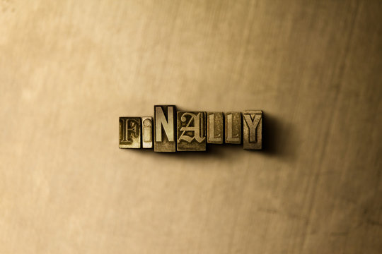 FINALLY - close-up of grungy vintage typeset word on metal backdrop. Royalty free stock - 3D rendered stock image.  Can be used for online banner ads and direct mail.