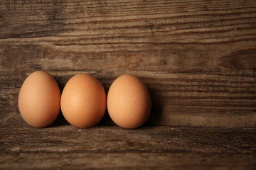 Eggs on wooden background