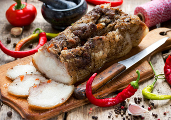 Baked pork belly with garlic spices hot chili peppers