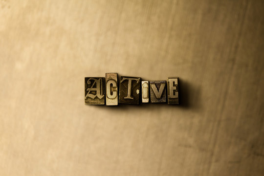 ACTIVE - close-up of grungy vintage typeset word on metal backdrop. Royalty free stock - 3D rendered stock image.  Can be used for online banner ads and direct mail.
