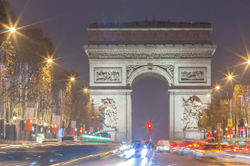 Fototapeta na wymiar The Triumphal Arch and Champs Elysees avenue decorated for Christmas, Paris, France.