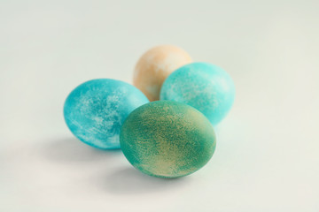 Colorful Easter eggs on light background