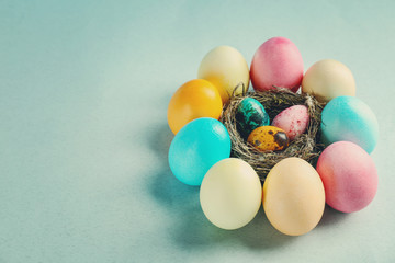 Composition of Easter eggs on color background