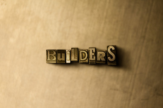 BUILDERS - close-up of grungy vintage typeset word on metal backdrop. Royalty free stock - 3D rendered stock image.  Can be used for online banner ads and direct mail.