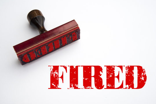 A 3d rendering of a rubber stamp with the word "fired"