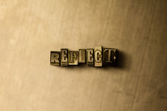 REFLECT - close-up of grungy vintage typeset word on metal backdrop. Royalty free stock - 3D rendered stock image.  Can be used for online banner ads and direct mail.