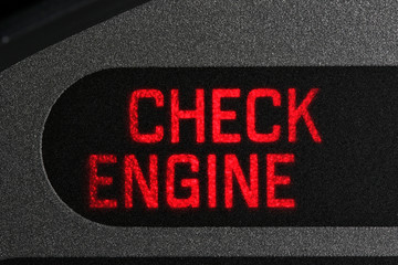 check engine warning light in car dashboard
