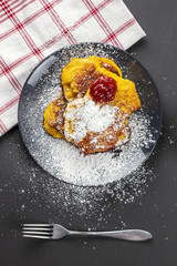 Pumpkin pancake with redcurrant marmalade and sugar