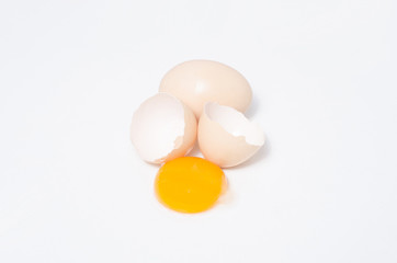 Eggs chicken bird with egg yolk and shell on a gray background