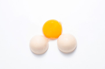 Eggs chicken bird with egg yolk and shell on a gray background