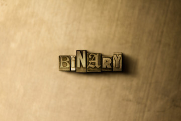 BINARY - close-up of grungy vintage typeset word on metal backdrop. Royalty free stock - 3D rendered stock image.  Can be used for online banner ads and direct mail.