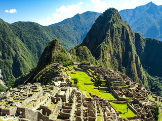 Machu Picchu, peruvian lost city of Incas situated on mountain ridge above Sacred Valley of Urubamba River in Cusco Region, Peru. UNESCO World Heritage and one of the New Seven Wonders of the World