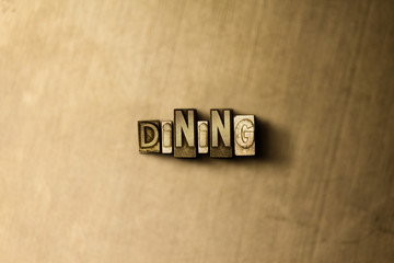 DINING - close-up of grungy vintage typeset word on metal backdrop. Royalty free stock - 3D rendered stock image.  Can be used for online banner ads and direct mail.