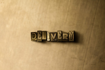 DELIVERY - close-up of grungy vintage typeset word on metal backdrop. Royalty free stock - 3D rendered stock image.  Can be used for online banner ads and direct mail.