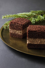 Chocolate cake on a golden plate