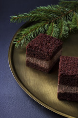 Chocolate cake on a golden plate