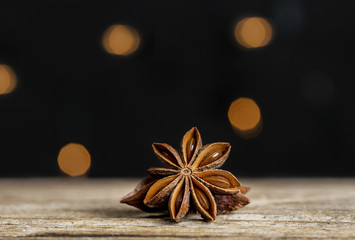 Anise star with lights in the background