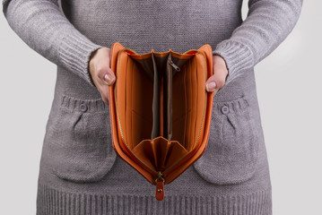 empty purse in women's hands