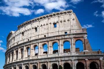 Colosseum with clear blue sky and clouds, Rome