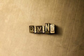 DIVING - close-up of grungy vintage typeset word on metal backdrop. Royalty free stock - 3D rendered stock image.  Can be used for online banner ads and direct mail.