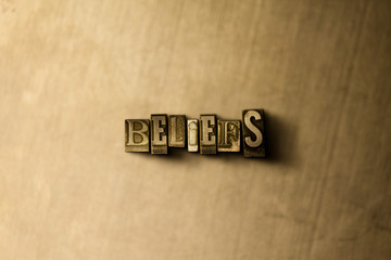 BELIEFS - close-up of grungy vintage typeset word on metal backdrop. Royalty free stock - 3D rendered stock image.  Can be used for online banner ads and direct mail.