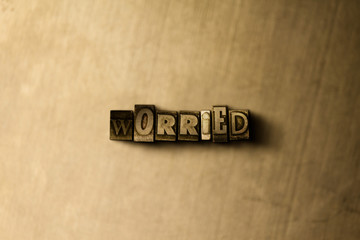 WORRIED - close-up of grungy vintage typeset word on metal backdrop. Royalty free stock - 3D rendered stock image.  Can be used for online banner ads and direct mail.