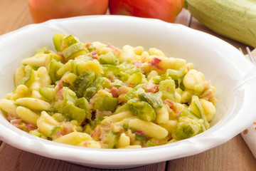 Cavatelli pasta with bacon and courgettes