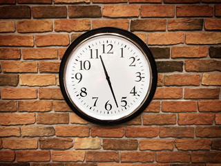 Fototapeta na wymiar Clock On Brick Wall