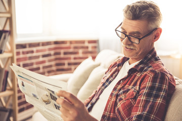 Handsome mature man at home