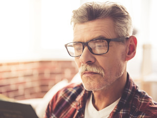 Handsome mature man at home