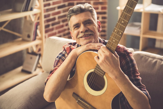 Handsome Mature Man With Guitar