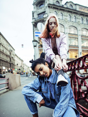 cute young couple of teenagers girlfriends having fun, traveling europe, modern fashion citylife, lifestyle people concept