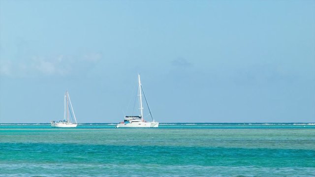 Luxury Sailing Boats Yachts in Tropical South Pacific Waters of French Polynesia during Good Sunshine Weather