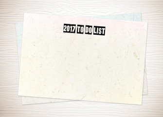 2017 to do list words on blank paper on white wood background