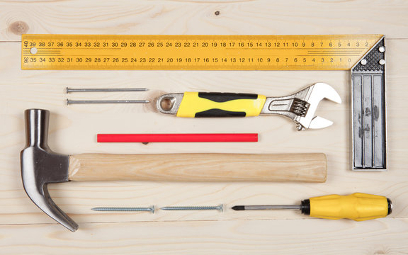 Set of working tools for carpentry works on the wooden table
