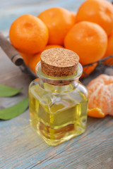 Tangerine essential oil in a glass bottle