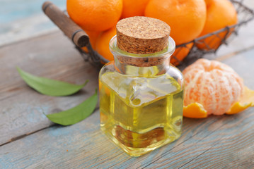 Tangerine essential oil in a glass bottle