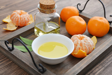 Tangerine essential oil in a glass bottle