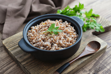 Buckwheat porridge in black casserole