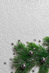 Fir tree with silver christmas toys and snowflakes on the white background