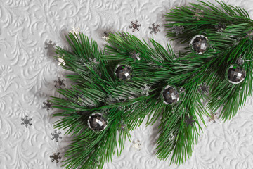 Fir tree with silver christmas toys and snowflakes on the white background