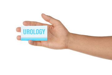 Male hand holding card with inscription UROLOGY, isolated on white