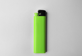 Blank green cigar lighter on white background