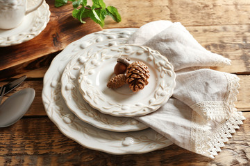 Set of dinnerware on wooden table